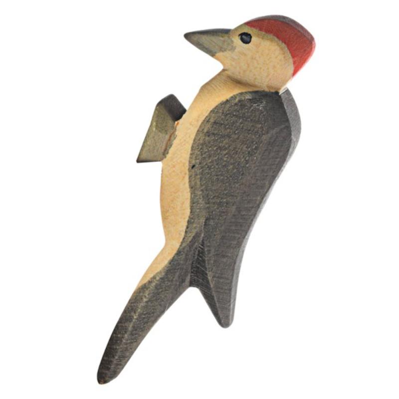 Wooden toy woodpecker on a white background