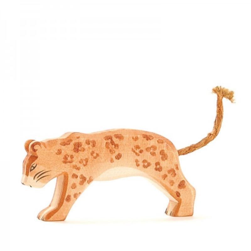 Wooden toy leopard figure on a white background