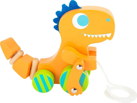 Small Foot wooden pull-along dinosaur toy in orange with wheels, designed for toddlers