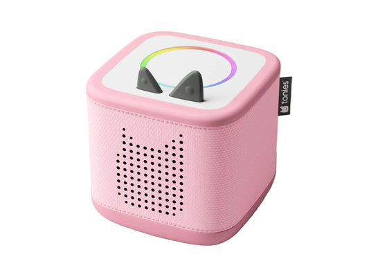 Pink toy speaker with shark fins on a white background