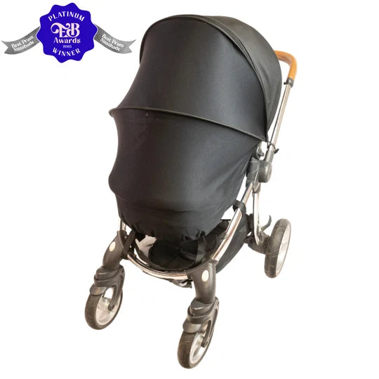 Black stroller with a visible award badge on a white background