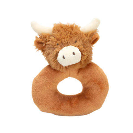 Plush toy shaped like a highland cow on a white background