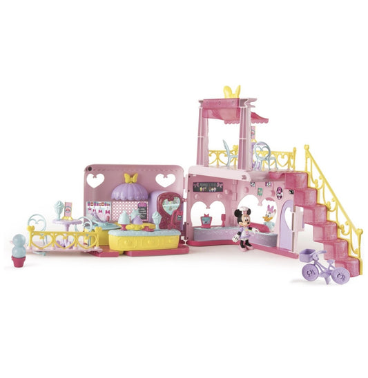 Toy playset with pink and yellow architecture on a white background